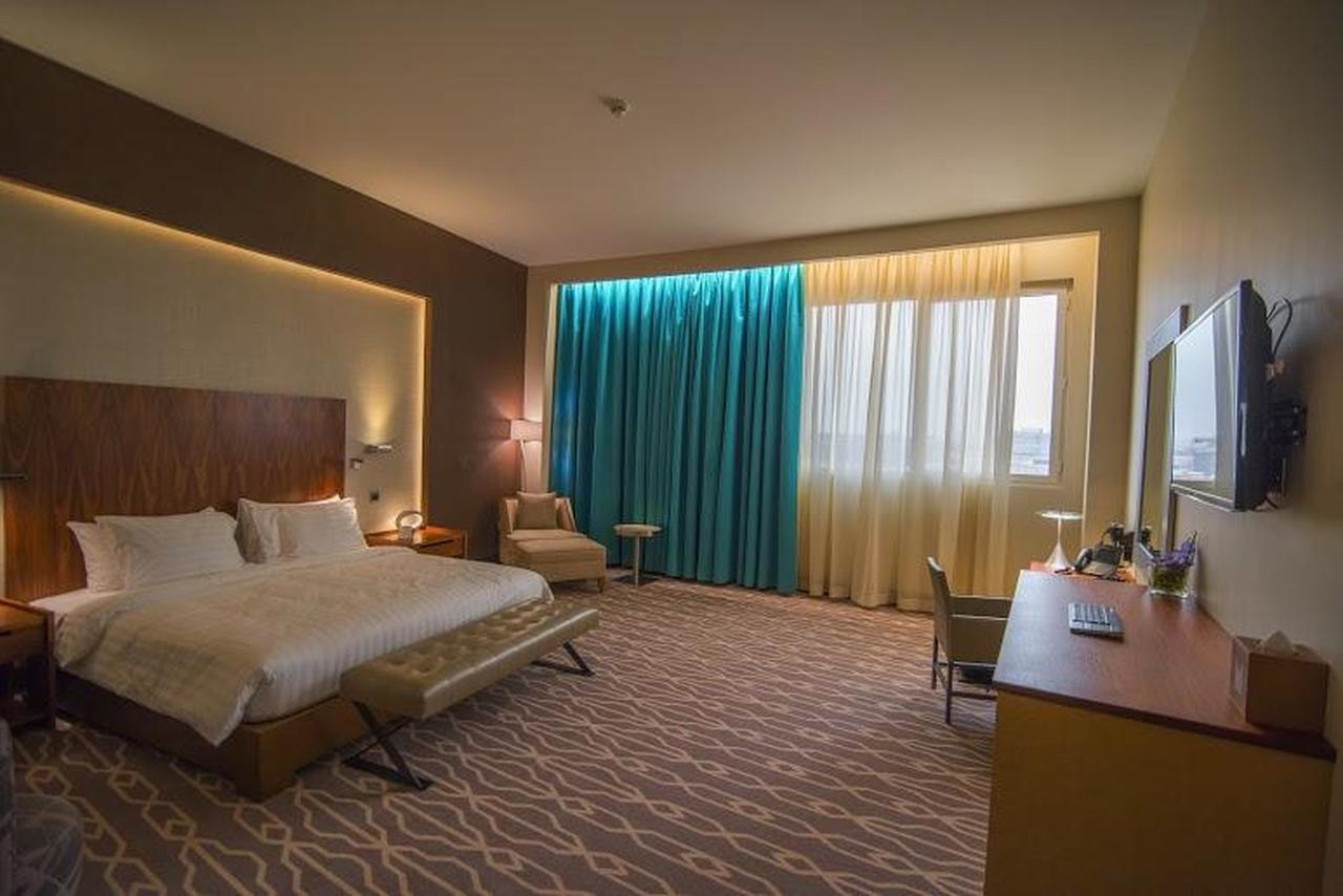 Millennium Hail Hotel Kültér fotó A room at the hotel